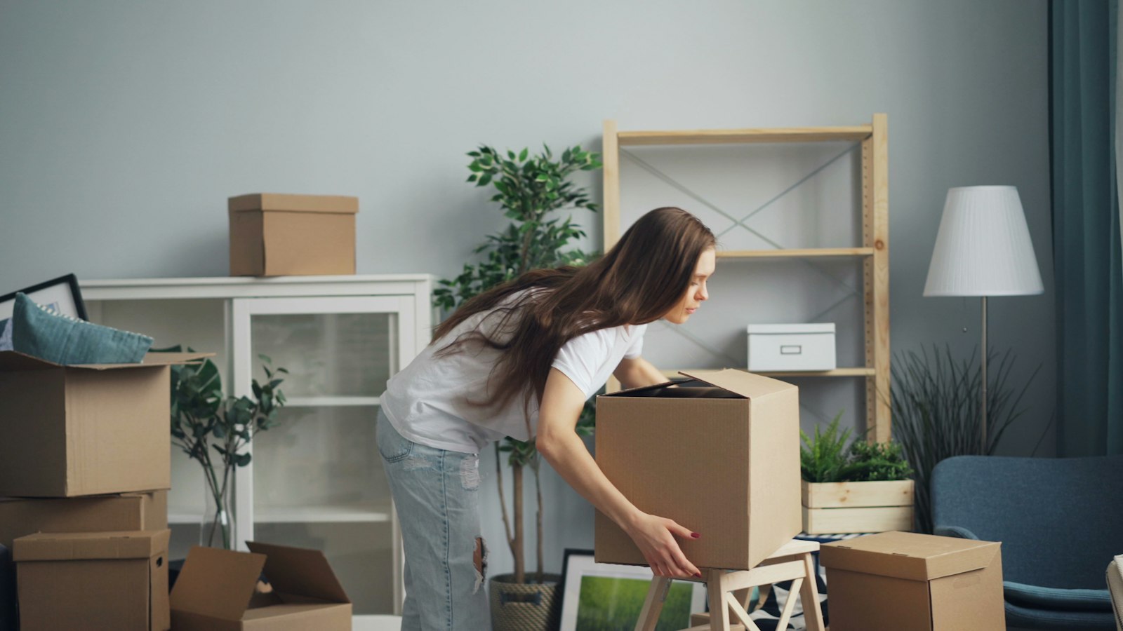 Person packing moving boxes