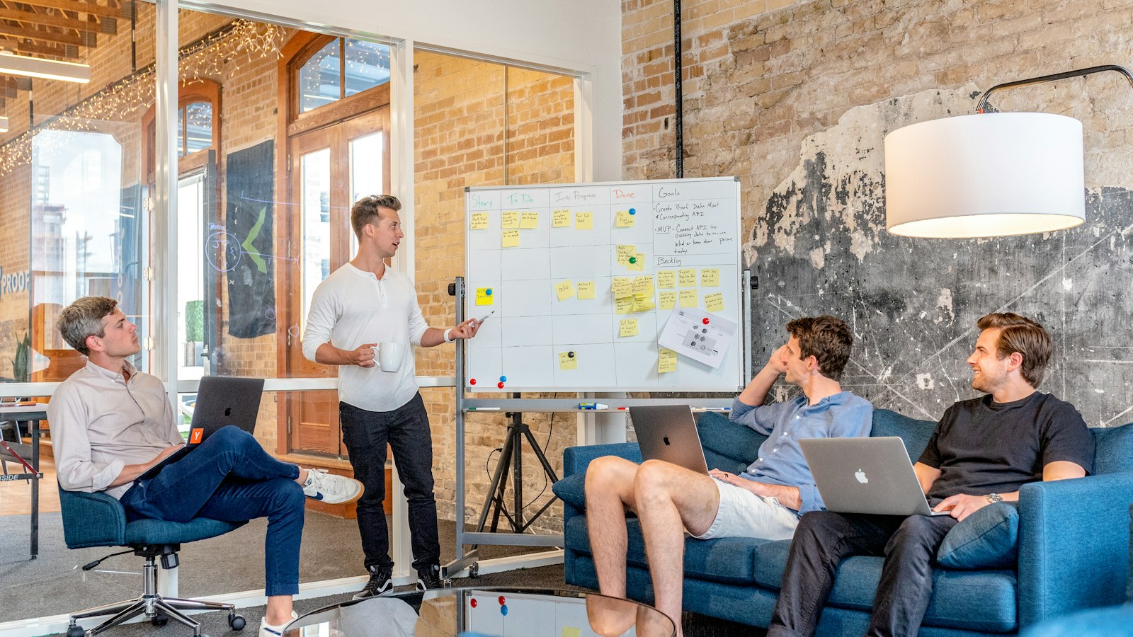 Marketing team meeting at a whiteboard