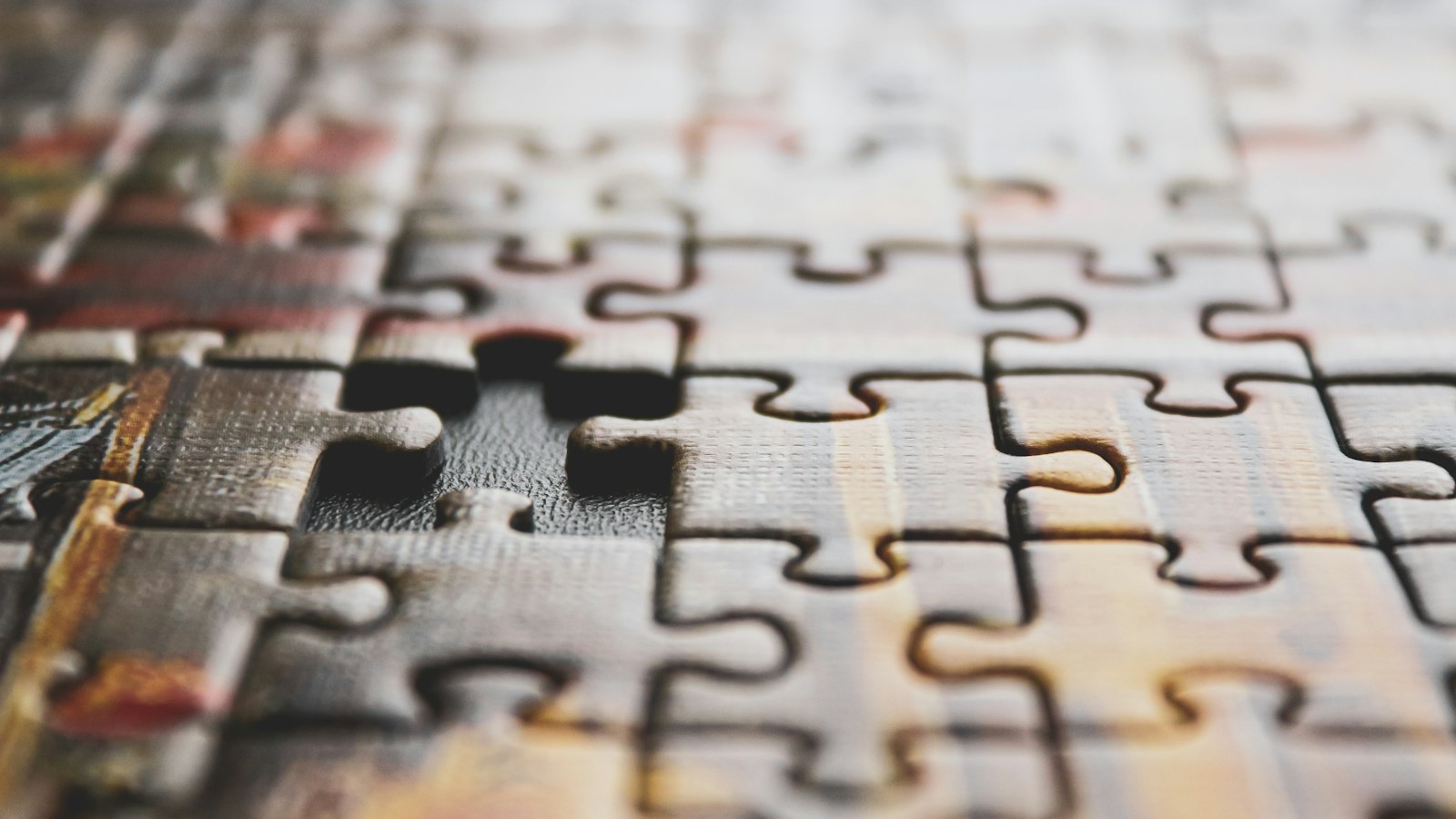 Puzzle pieces being put together